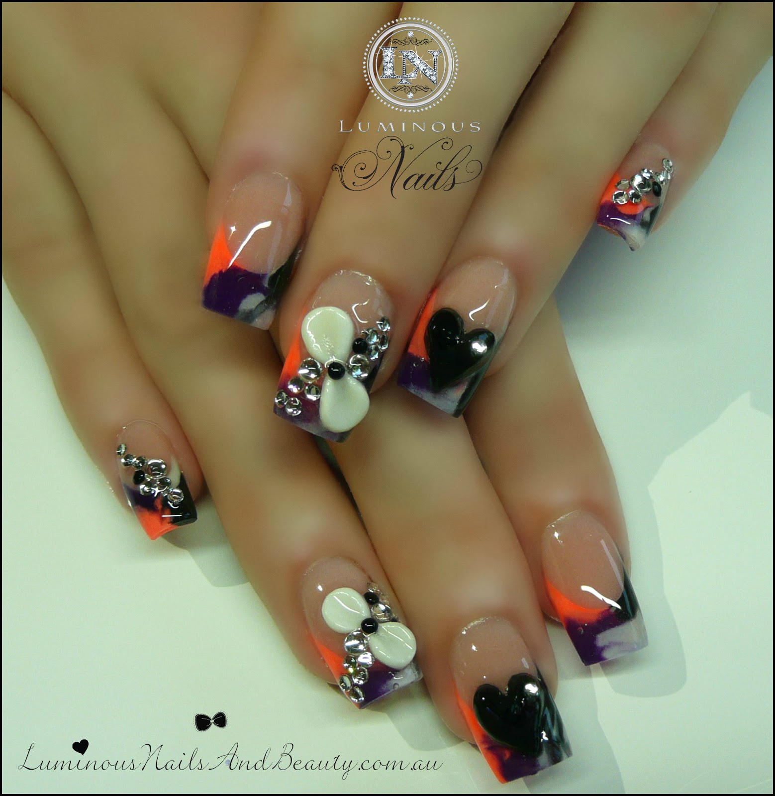 Luminous Nails & Beauty, Gold Coast Queensland. Acrylic Nails, Gel Nails, Spray Tans. Sculptured Acrylic with Rainbow Black, White & purple, Neon Peach, 3D bows & hearts, & Crystals.
