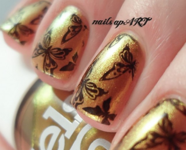 nail-art-designs-exotic-golden-butterfly-nail-art-photo-gallery-2013-loveliness-style-butterfly-nail-art-666x538