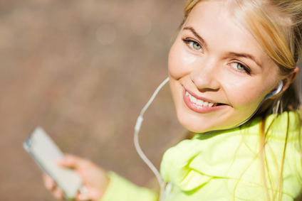 woman listening to music outdoors