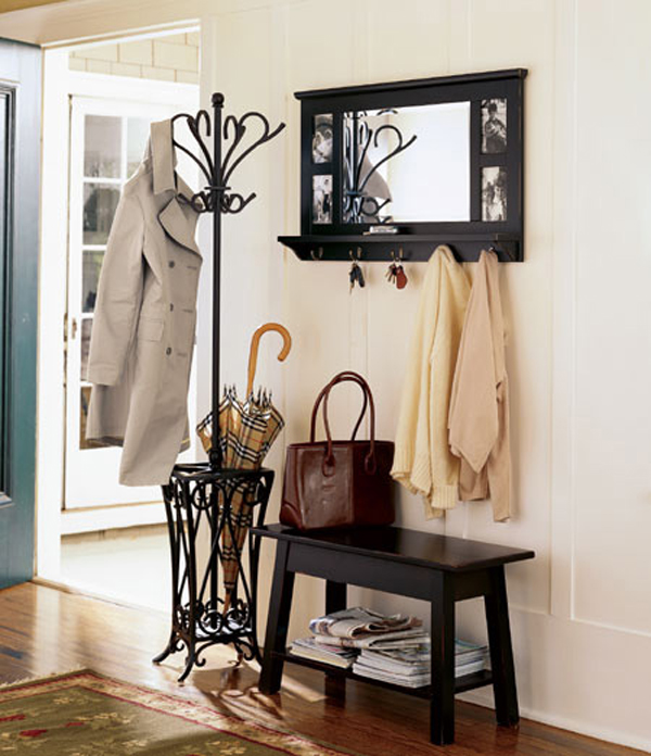 small-and-simple-entryway-furniture-decorating-ideas-with-black-wooden-table-with-newspaper-shelf-plus-iron-umbrella-stand-and-clothing-hooks-plus-small-wall-mirror-ideas