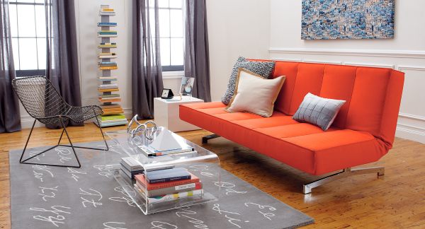 A-bright-orange-sleeper-sofa-in-a-modern-living-room